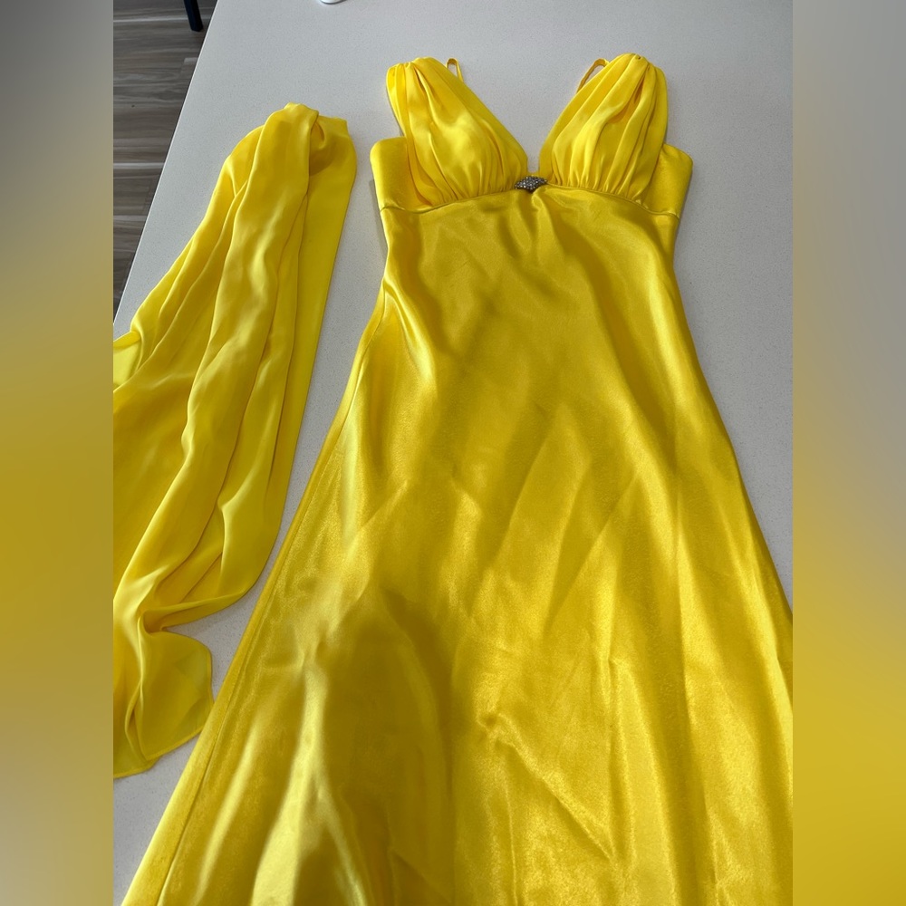 Woman’s yellow long satin dress, size medium. Worn only once. Sold as is.